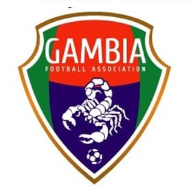 The redesigned Gambia Football Association crest: a shield in the national colours with a scorpion above a football